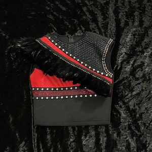 Black and red vest with feathers